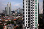 Foto, Bild: Blick vom Four Seasons Hotel auf die City mit Hütten und Hochhäusern